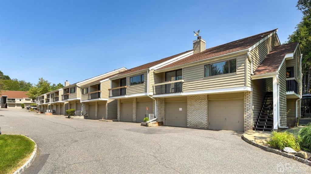 3 The Crescent Clinton, NJ 08809 - Photo 3 of 37 a front view of a house with a yard