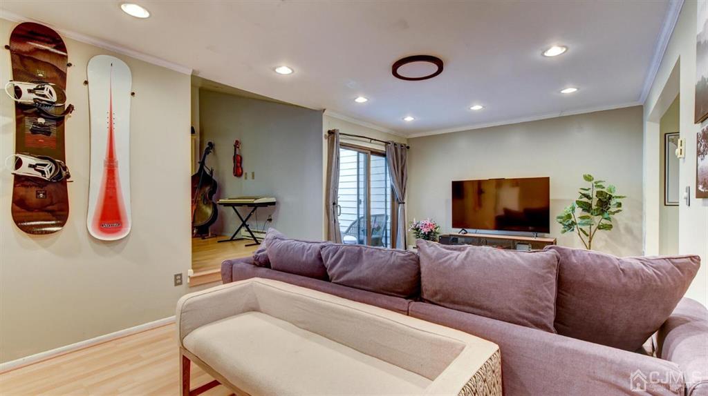 3 The Crescent Clinton, NJ 08809 - Photo 9 of 37 a living room with furniture and a flat screen tv