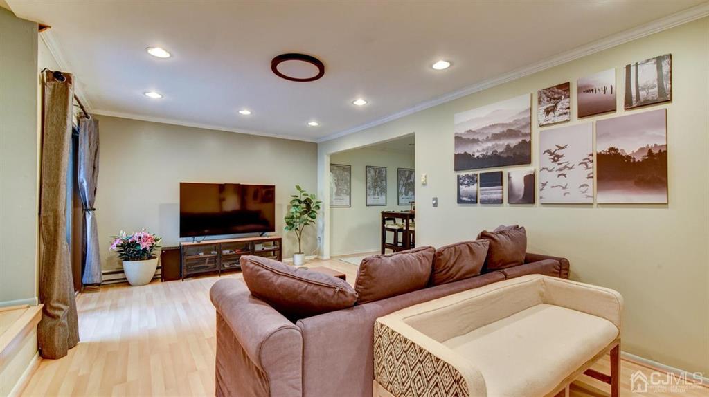 3 The Crescent Clinton, NJ 08809 - Photo 10 of 37 a living room with furniture and a flat screen tv