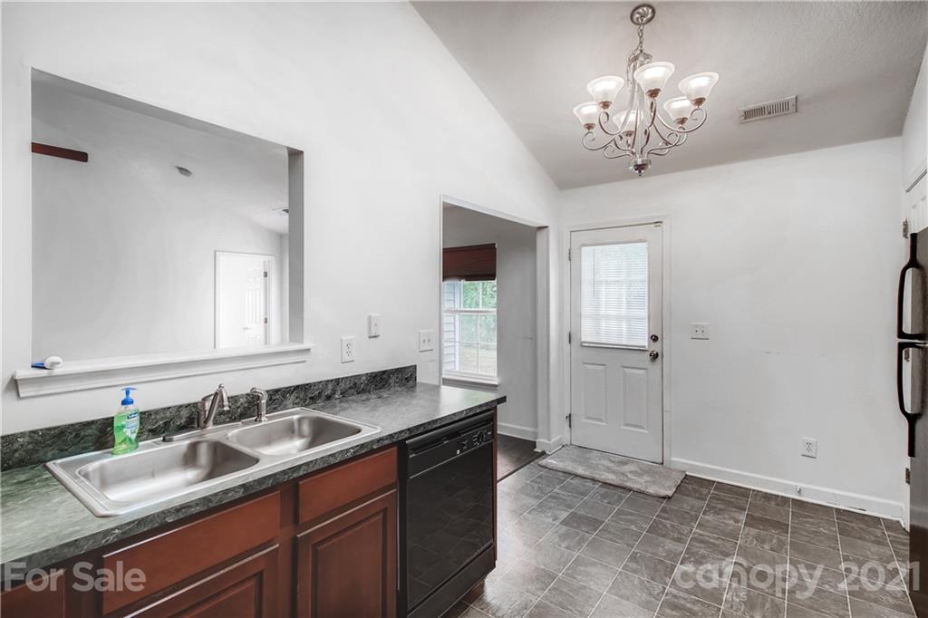 1416 Key Ridge Court Charlotte, NC 28216 - Photo 11 of 28 a bathroom with a granite countertop sink and a mirror