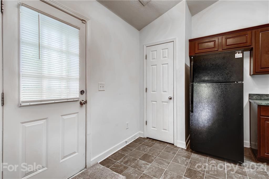 1416 Key Ridge Court Charlotte, NC 28216 - Photo 13 of 28 a view of empty room with windows and wardrobe