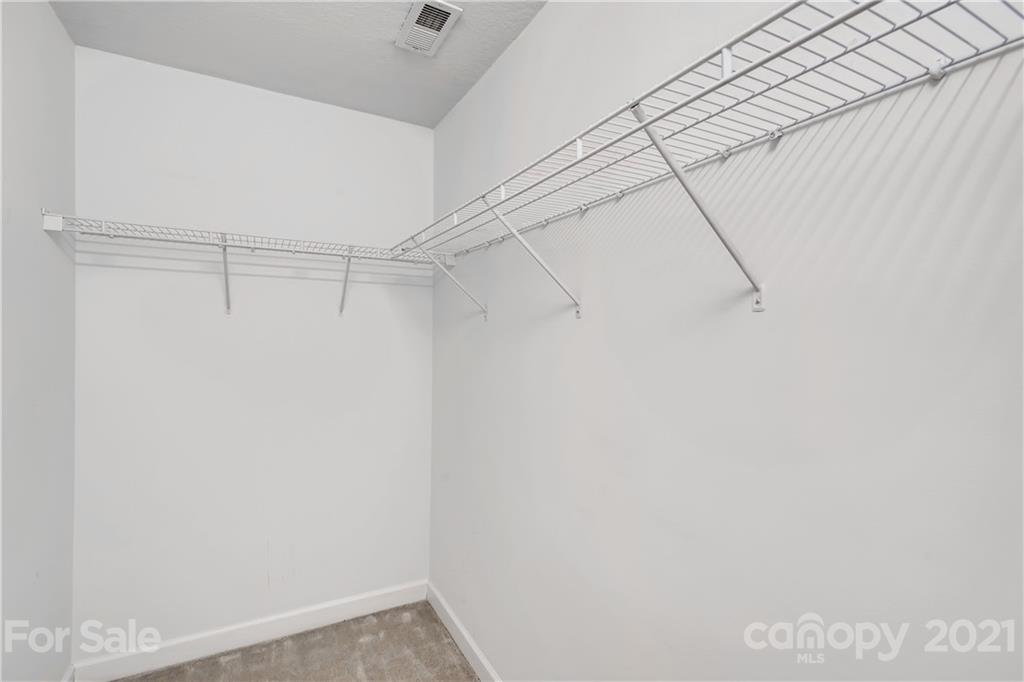1416 Key Ridge Court Charlotte, NC 28216 - Photo 17 of 28 a view of a room with racks on the wall