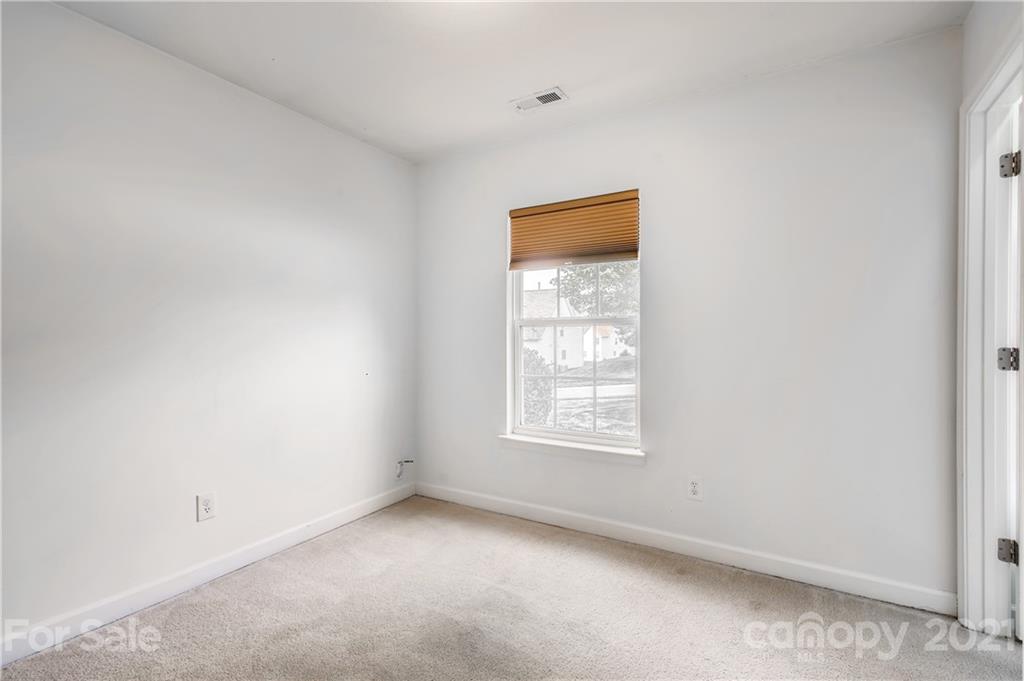 1416 Key Ridge Court Charlotte, NC 28216 - Photo 18 of 28 an empty room with a window