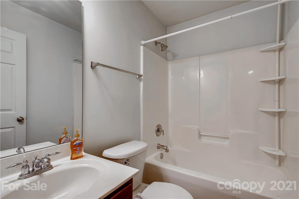 1416 Key Ridge Court Charlotte, NC 28216 - Photo 19 of 28 a bathroom with a sink toilet and shower