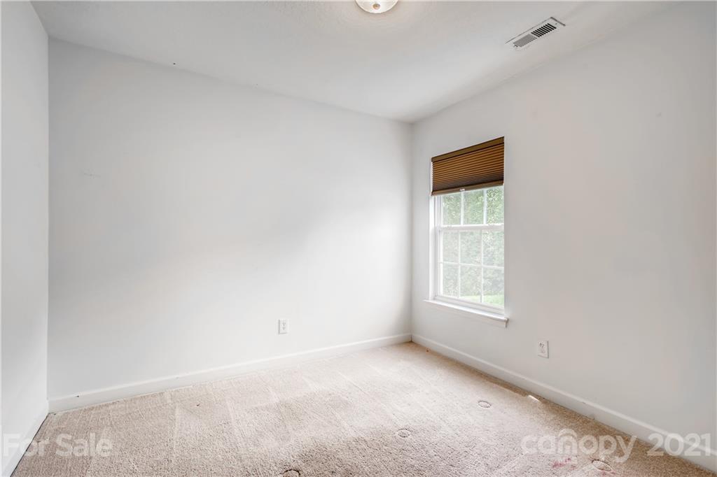 1416 Key Ridge Court Charlotte, NC 28216 - Photo 20 of 28 a view of an empty room with a window