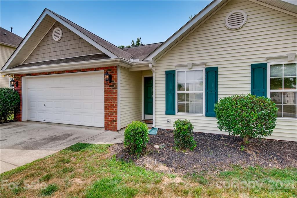 1416 Key Ridge Court Charlotte, NC 28216 - Photo 3 of 28 a front view of a house with garden