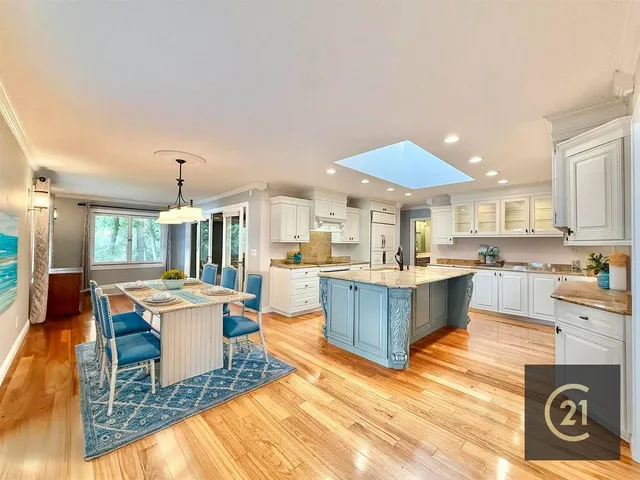 a kitchen that has a sink and a stove