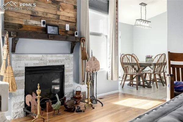 a view of a livingroom with furniture and a fireplace