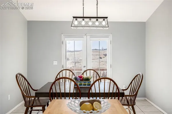 a view of a dining room with furniture window and outside view