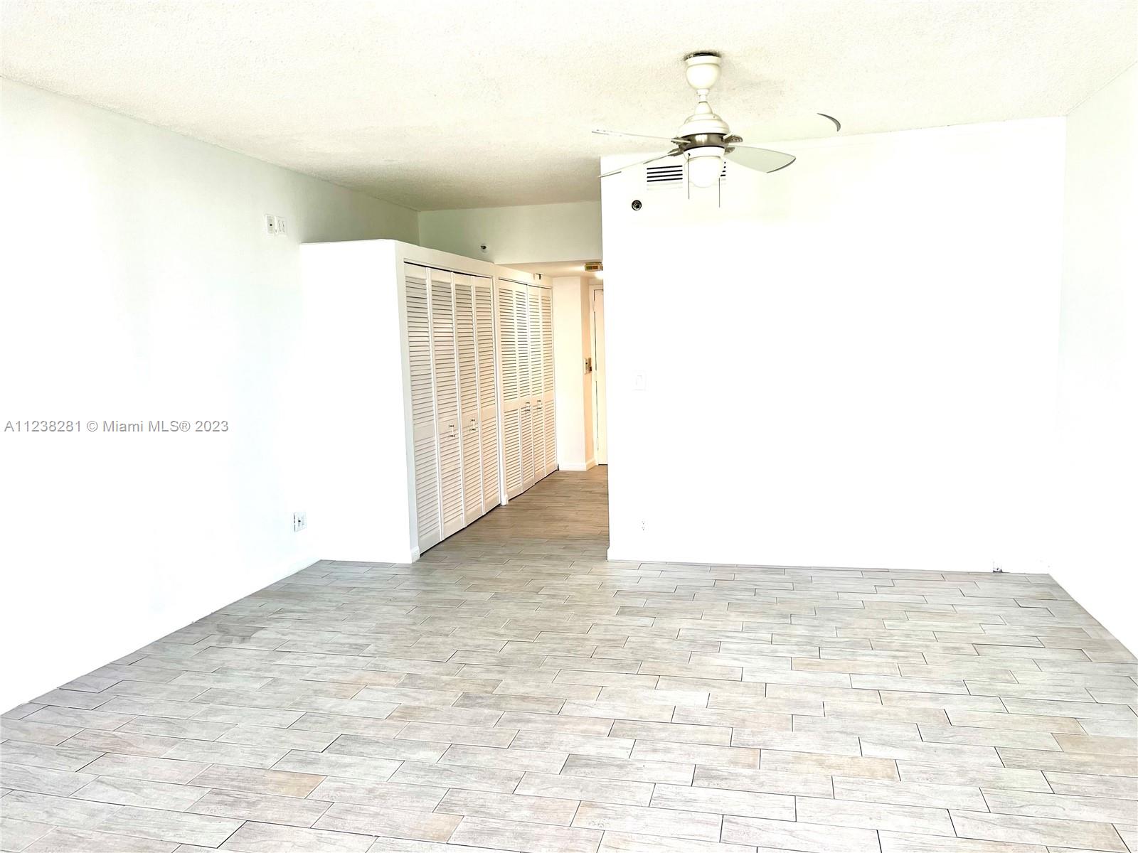 520 Brickell Key Drive, Unit A917 Miami, FL 33131 - Photo 4 of 12 a view of a room with wooden floor
