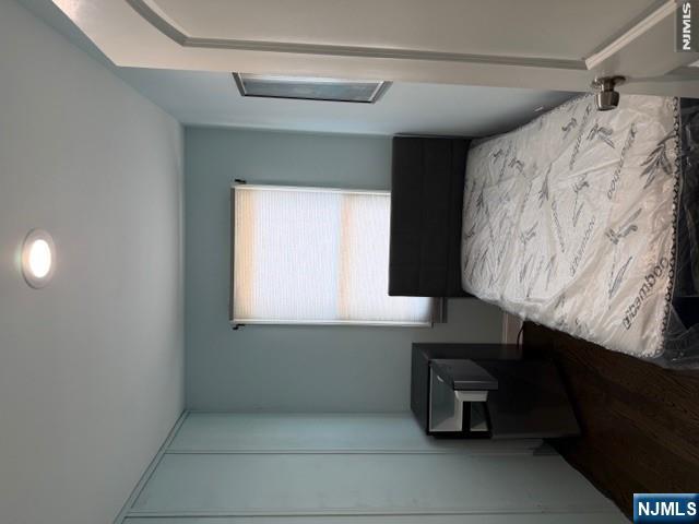 177 Maple Street Fairview, NJ 07022 - Photo 3 of 24 a bedroom with a bed and a window