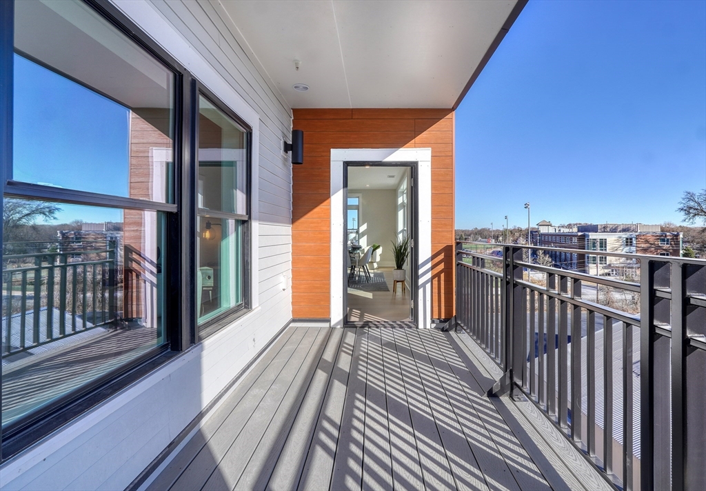 62 Foundry Street, Unit 506 Wakefield, MA 01880 - Photo 8 of 42 a view of a balcony with wooden floor