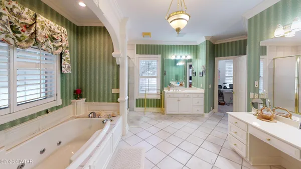 a bathroom with a bathtub and a shower