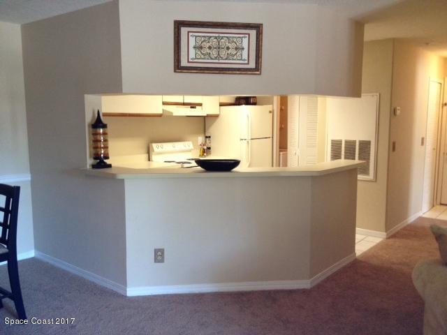 7667 North Wickham Road, Unit 308 Melbourne, FL 32940 - Photo 3 of 10 bar & kitchen