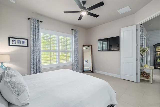 a bedroom with a bed and a tv