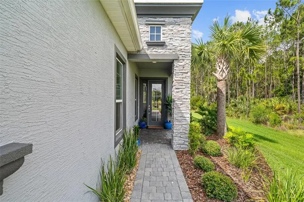 a view of a pathway besides a house