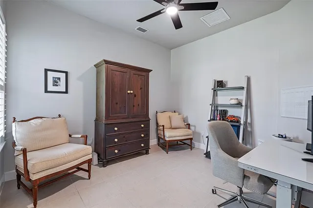 a bedroom with a workspace