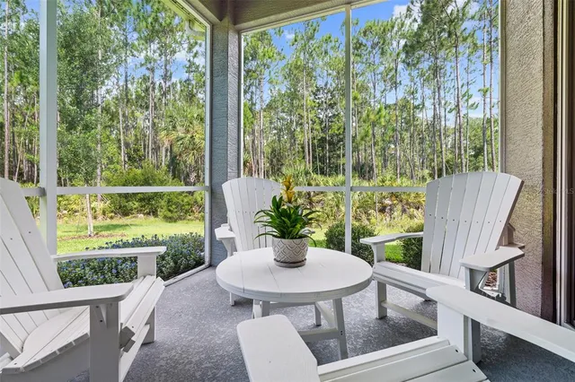 a view of a table and chairs in the patio