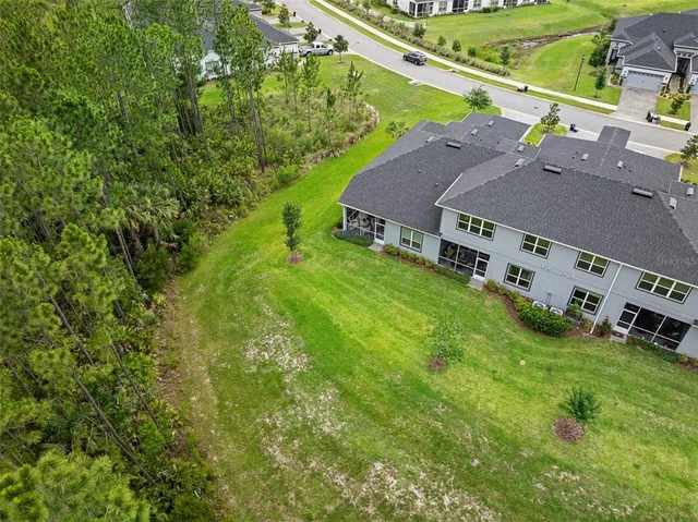 a aerial view of a house with pool