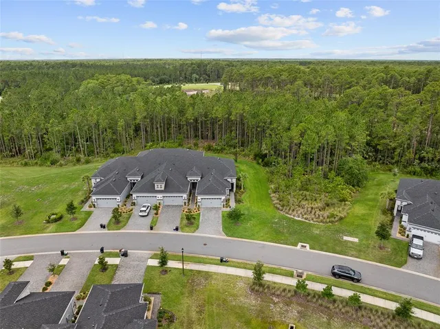 an aerial view of a house with a garden