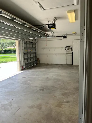 a kitchen with stainless steel appliances granite countertop a sink and a stove