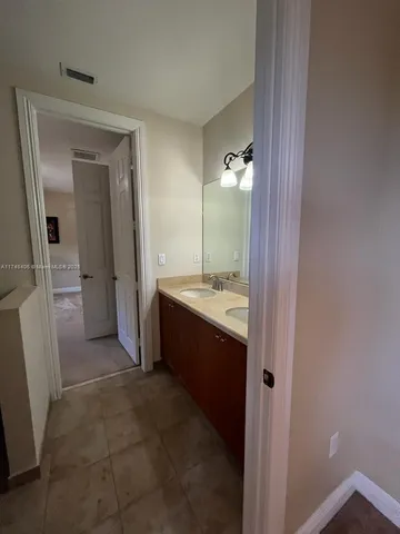 a view of entryway with wooden floor and stairs