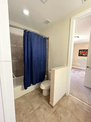 a view of a glass door and a yard