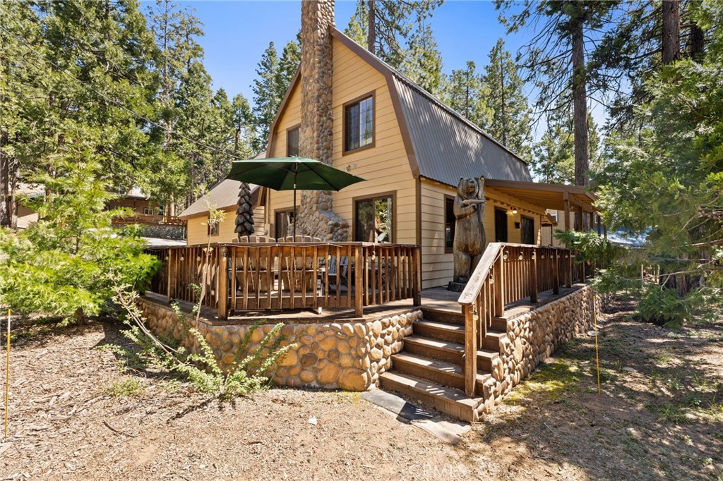 42031 North Aspen Road Shaver Lake, CA 93664 - Photo 1 of 49 front view of a house with a small yard
