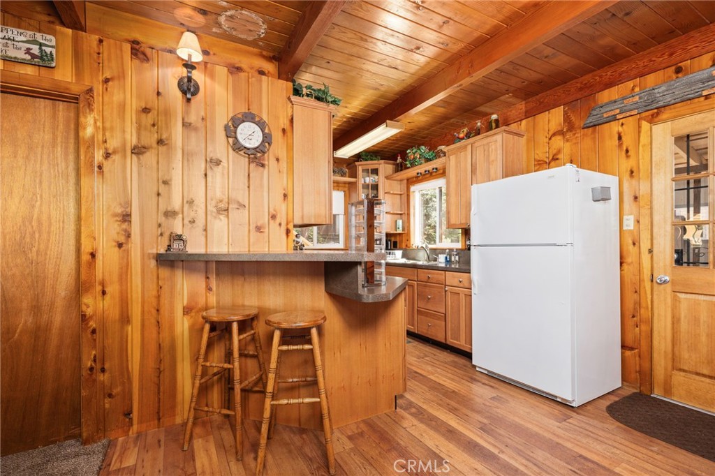 42031 North Aspen Road Shaver Lake, CA 93664 - Photo 14 of 49 a kitchen with stainless steel appliances granite countertop a refrigerator and a stove