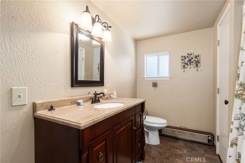 42031 North Aspen Road Shaver Lake, CA 93664 - Photo 28 of 49 a bathroom with a sink and a mirror