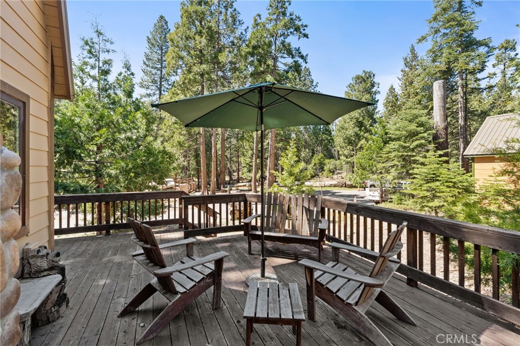 42031 North Aspen Road Shaver Lake, CA 93664 - Photo 44 of 49 a view of a chair and table on the deck