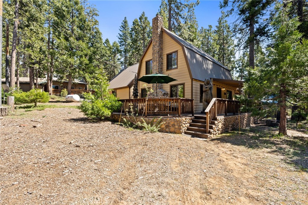 42031 North Aspen Road Shaver Lake, CA 93664 - Photo 45 of 49 a view of a house with a yard and sitting area