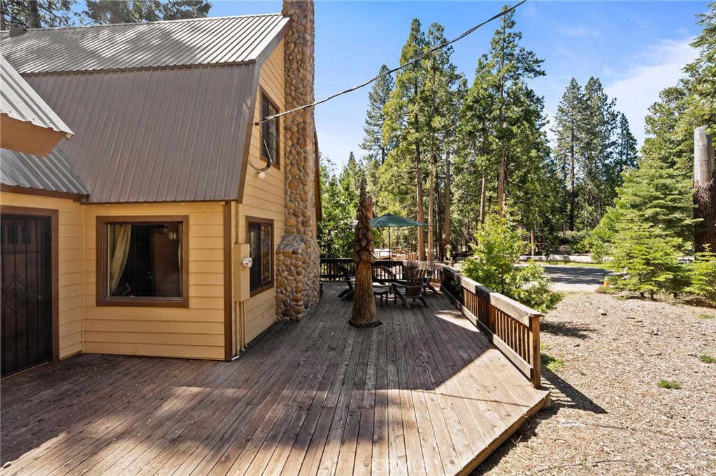 42031 North Aspen Road Shaver Lake, CA 93664 - Photo 48 of 49 a view of a house with backyard and sitting area