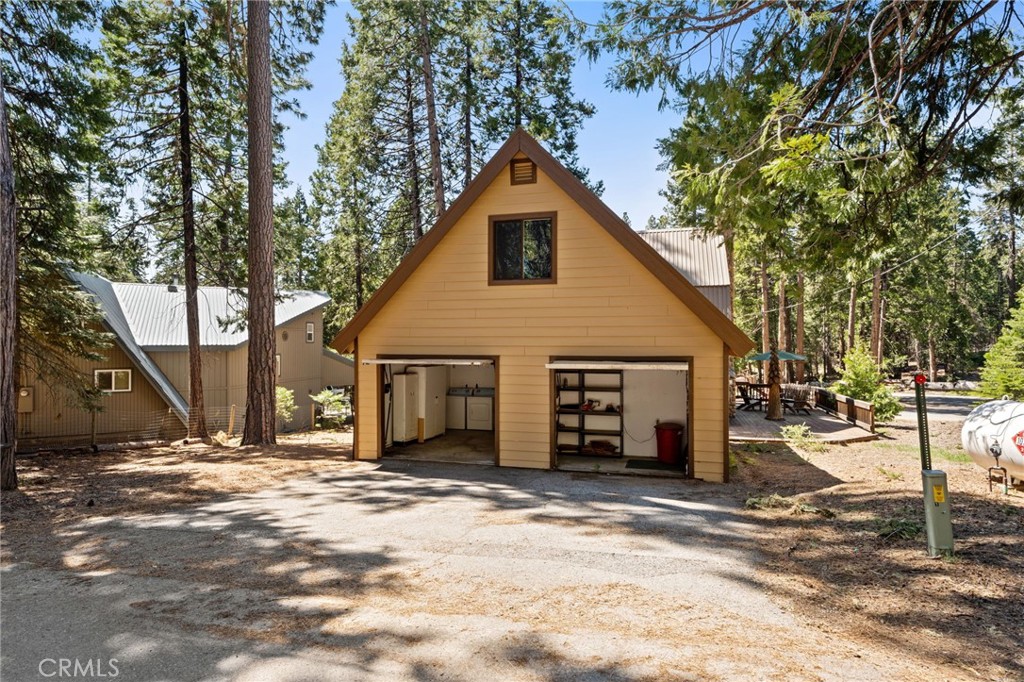 42031 North Aspen Road Shaver Lake, CA 93664 - Photo 6 of 49 a view of a house with a yard