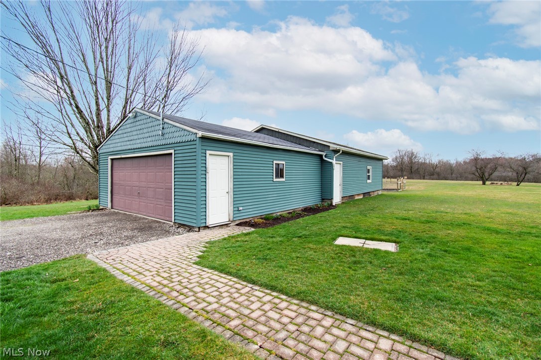 8370 Herbert Road Canfield, OH 44406 - Photo 5 of 48 Garage with a lawn