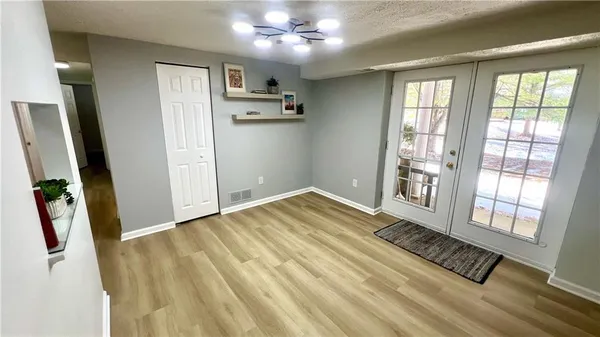 wooden floor in an empty room with a window
