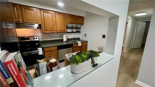 a kitchen with a refrigerator and a sink