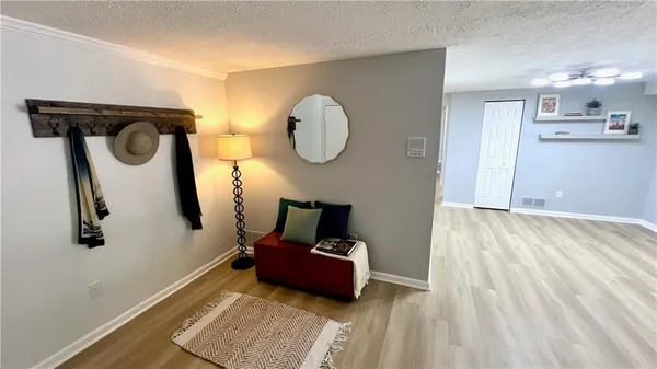 a living room with furniture and a mirror