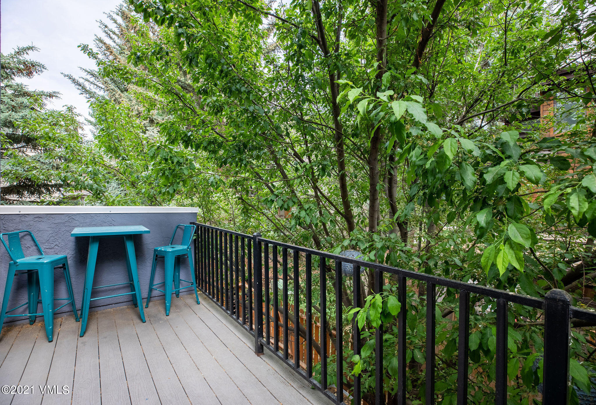 212 Eagle Road, Unit 3D Avon, CO 81620 - Photo 7 of 8 a view of a balcony with chairs