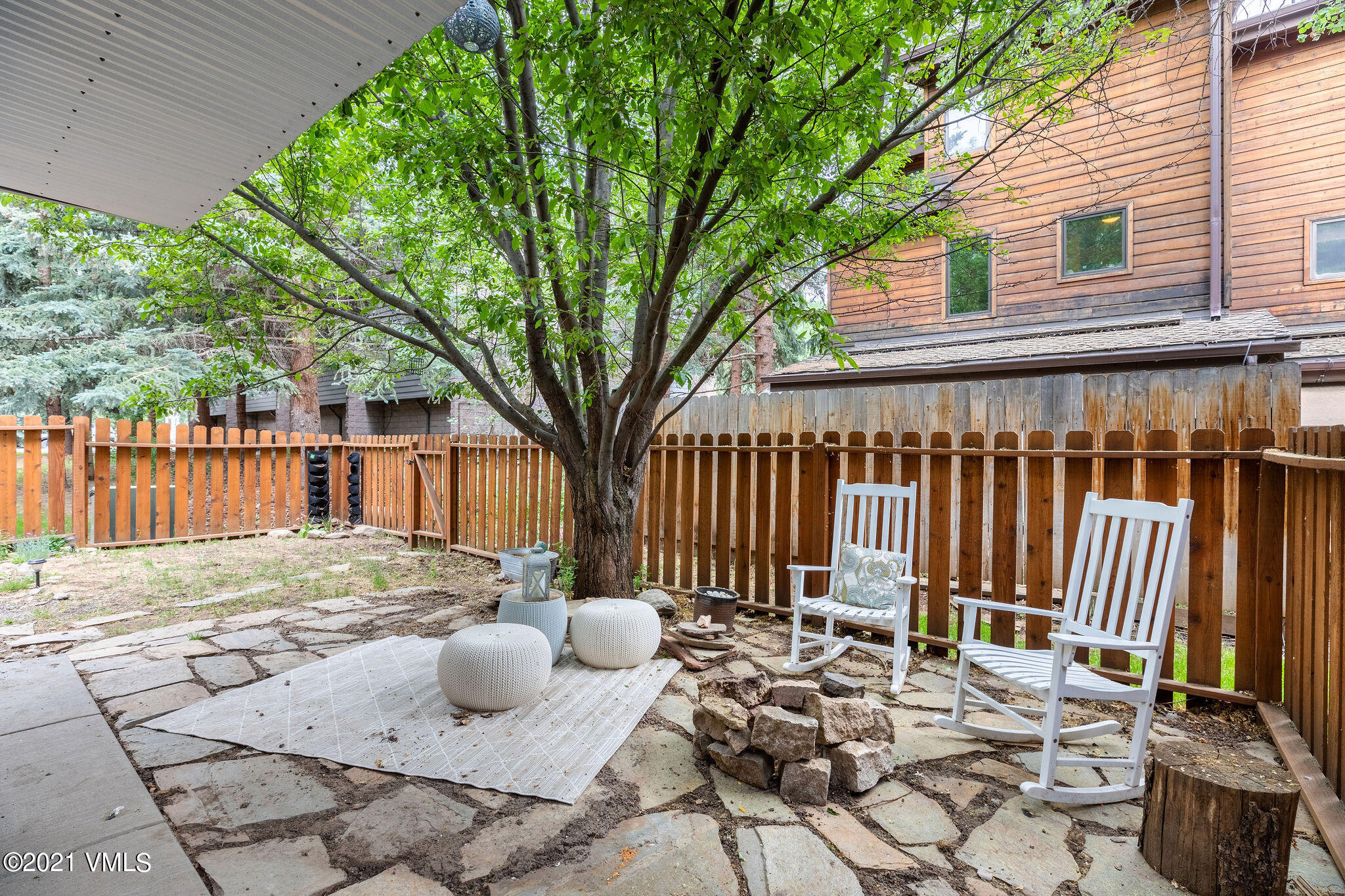 212 Eagle Road, Unit 3D Avon, CO 81620 - Photo 8 of 8 a view of a patio with a chairs and table in the patio