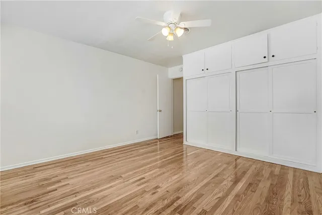 an empty room with wooden floor