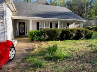 30 Freeman Point Covington, GA 30016 - Photo 1 of 1 a front view of a house with garden