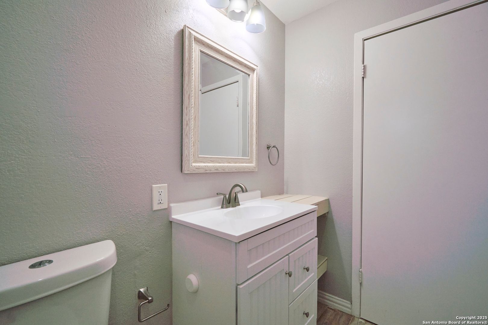 418 Verne Street, Unit 3 San Antonio, TX 78221 - Photo 17 of 21 a bathroom with a sink toilet and mirror