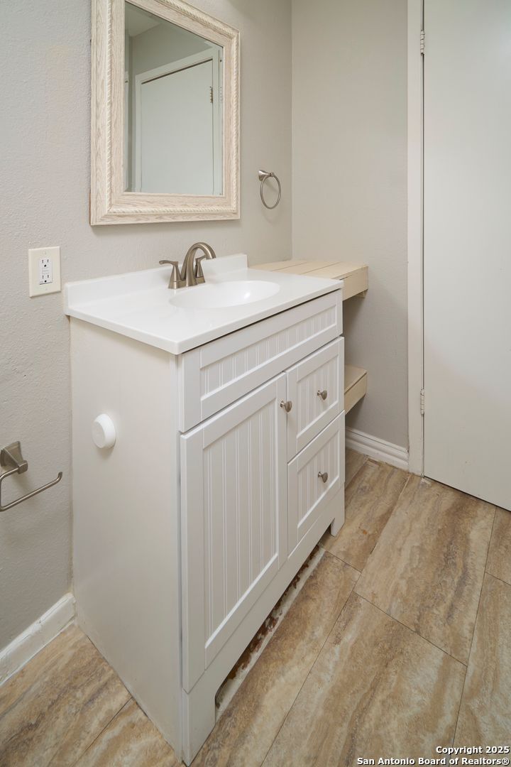 418 Verne Street, Unit 3 San Antonio, TX 78221 - Photo 20 of 21 a bathroom with a sink and a mirror