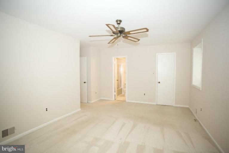 11806 Tree Fern Court Reston, VA 20191 - Photo 14 of 20 a view of a room with a ceiling fan