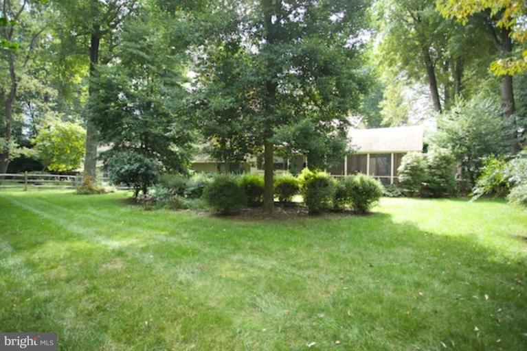 11806 Tree Fern Court Reston, VA 20191 - Photo 17 of 20 a view of house with outdoor space and garden