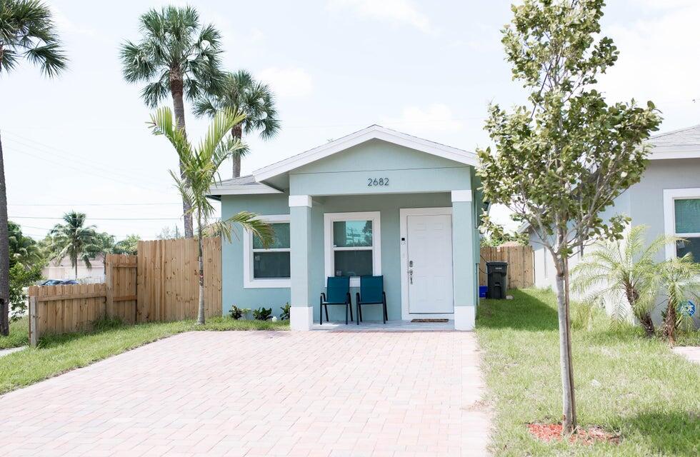 2682 Nokomis Avenue West Palm Beach, FL 33409 - Photo 1 of 12 a front view of a house with a garden