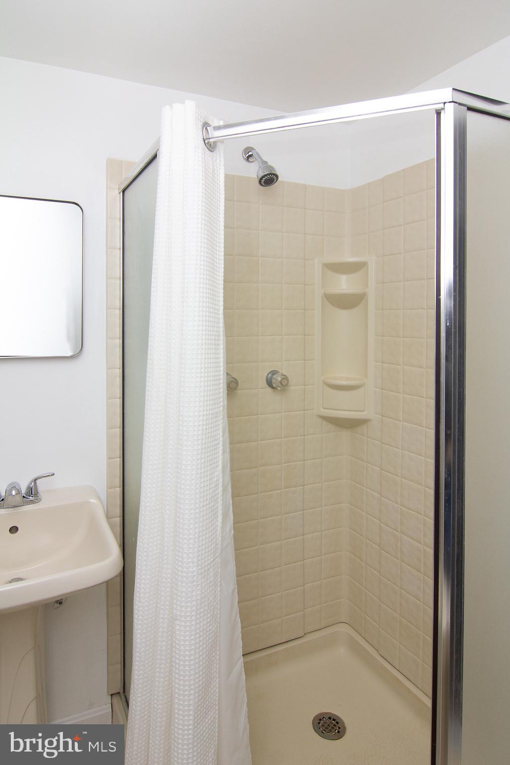 4813 Millers Station Road Hampstead, MD 21074 - Photo 15 of 32 a bathroom with a shower and sink