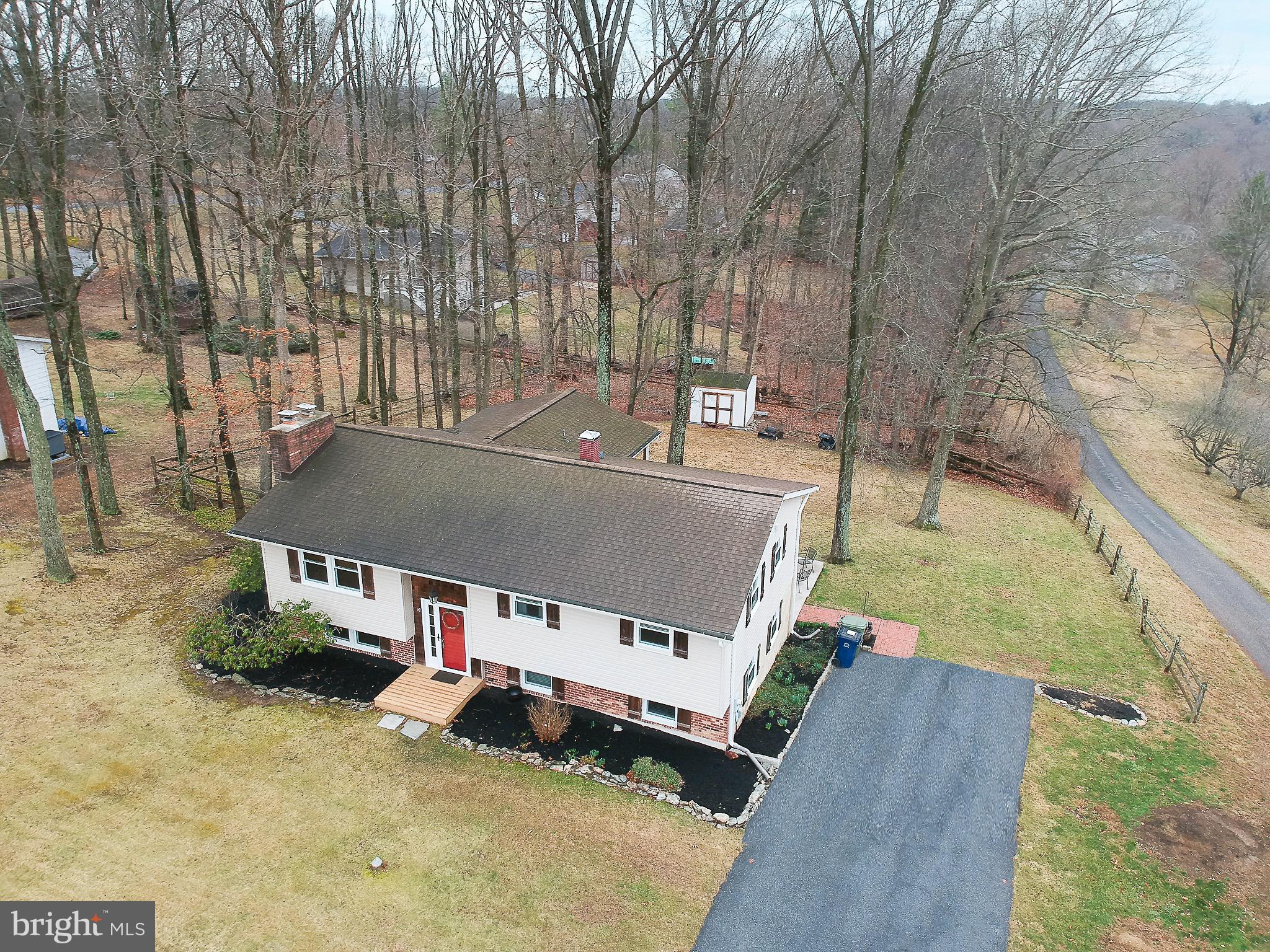 4813 Millers Station Road Hampstead, MD 21074 - Photo 2 of 32 an aerial view of a house with swimming pool