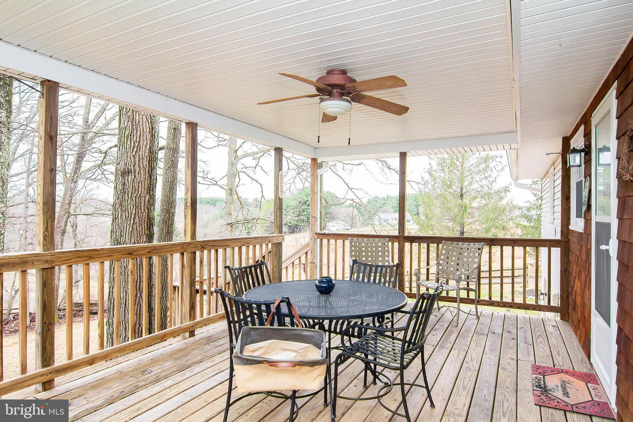 4813 Millers Station Road Hampstead, MD 21074 - Photo 26 of 32 a view of a dining room with furniture window and wooden floor